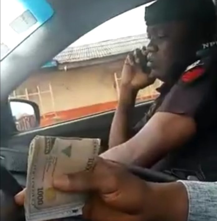 Nigeria Police Arrest Officer Videoed Collecting Bribe